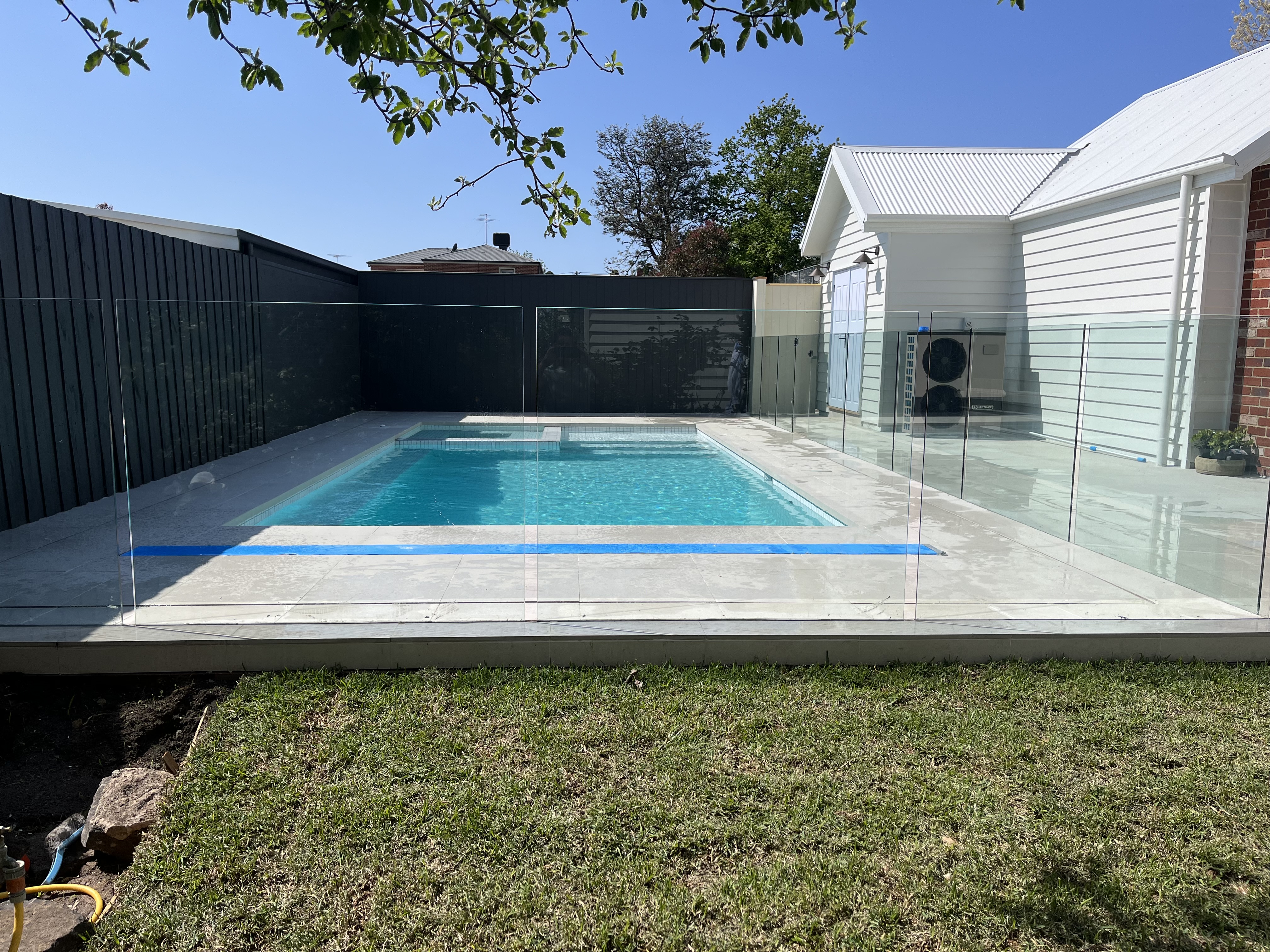 Frameless glass pool fencing on a rural property